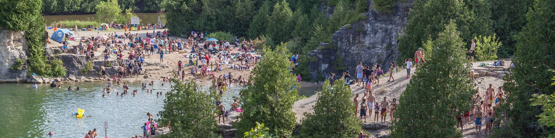 People swimming in Elora Quarry conservation area, Ontario, Canada
This two acre former limestone quarry is encircled by sheer cliffs up to 12 m high.