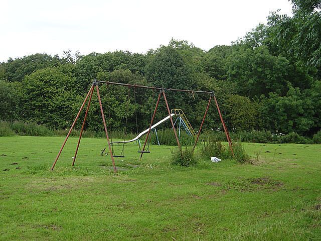Slide and swings This play equipment is at the far end of a field on the outskirts of Rossington and appears to be less than well looked after; not much evidence of use either.