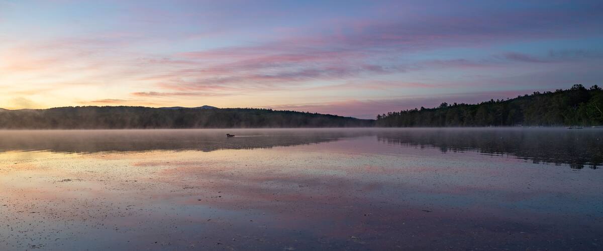 Soft Sunrise Over a Tranquil Lake in New Hampshire