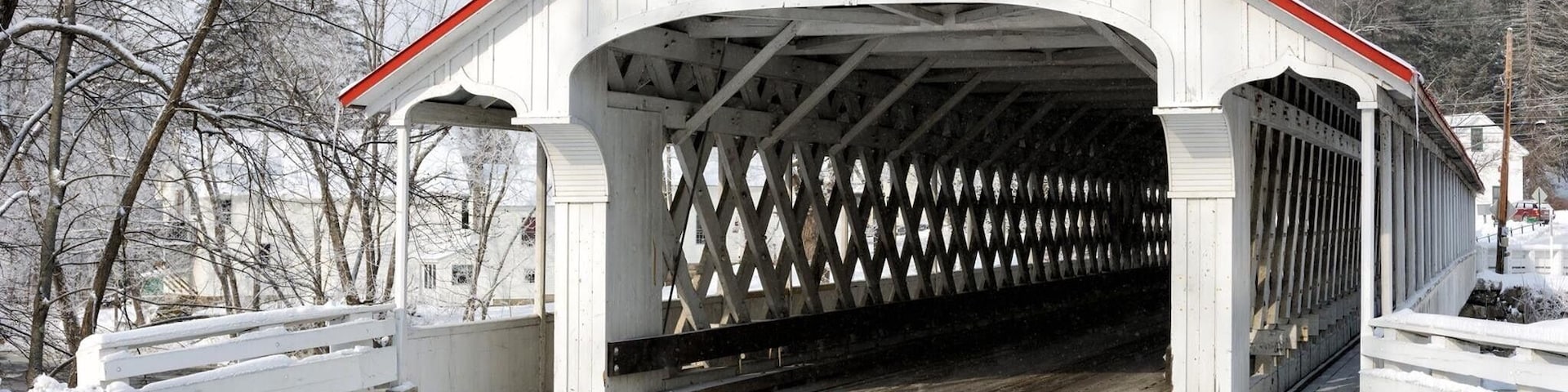 The Ashuelot Covered Bridge is a historic wooden covered bridge over the Ashuelot River on Bolton Road, just south of its intersection with NH 119 in Ashuelot, New Hampshire, an unincorporated village of Winchester.