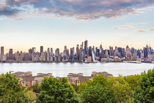 New York City midtown Manhattan skyline panorama view from Boulevard East Old Glory Park over Hudson River.