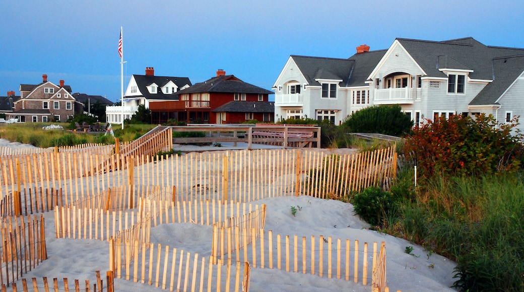 Summer vacation beach homes stand at the edge of the sand dunes on the Jersey Shore