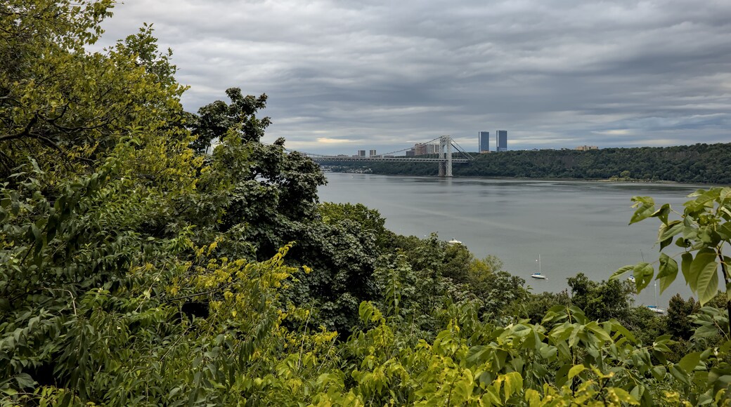 view of george washington bridge (gwb) cloudy day with hudson river and fort lee new jersey towers in background (palisades york manhattan city) fort tryon park scenic overlook travel tourism public