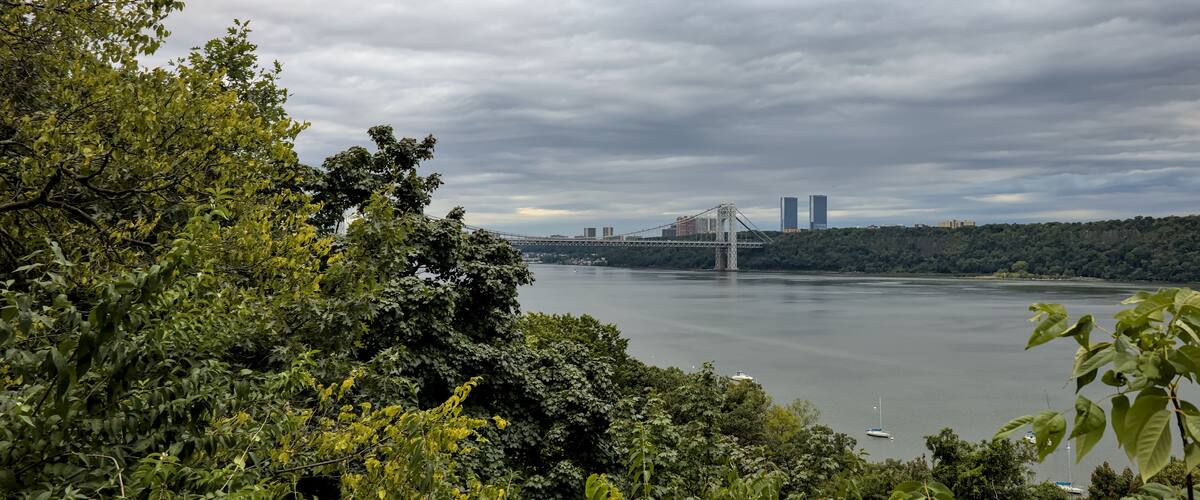 view of george washington bridge (gwb) cloudy day with hudson river and fort lee new jersey towers in background (palisades york manhattan city) fort tryon park scenic overlook travel tourism public