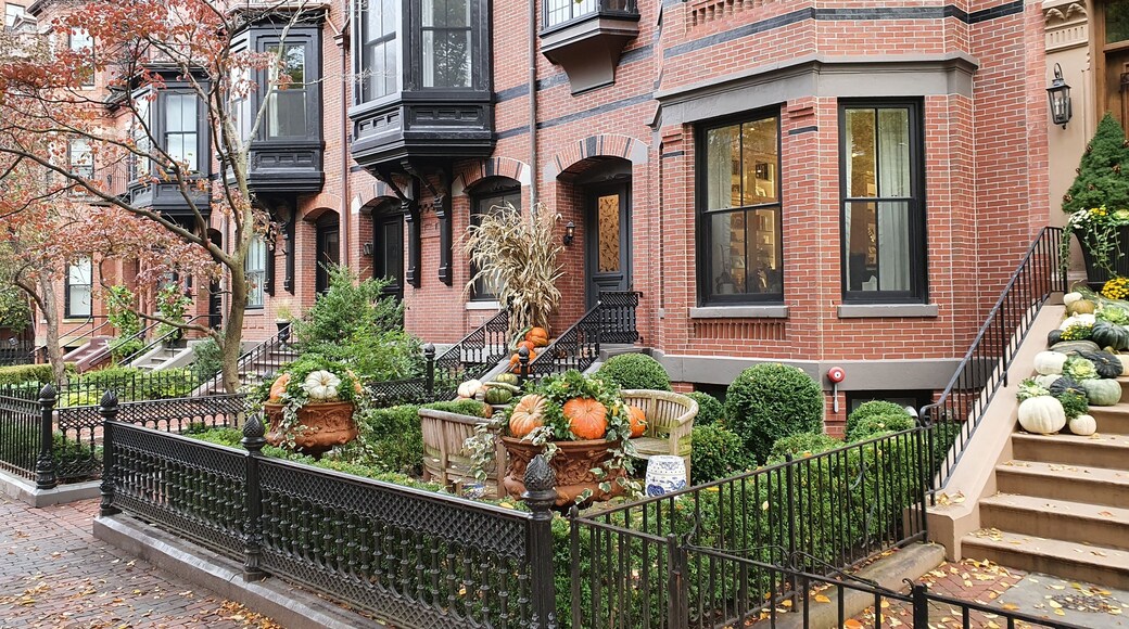 Halloween decorated old house with flowers and pumpkins