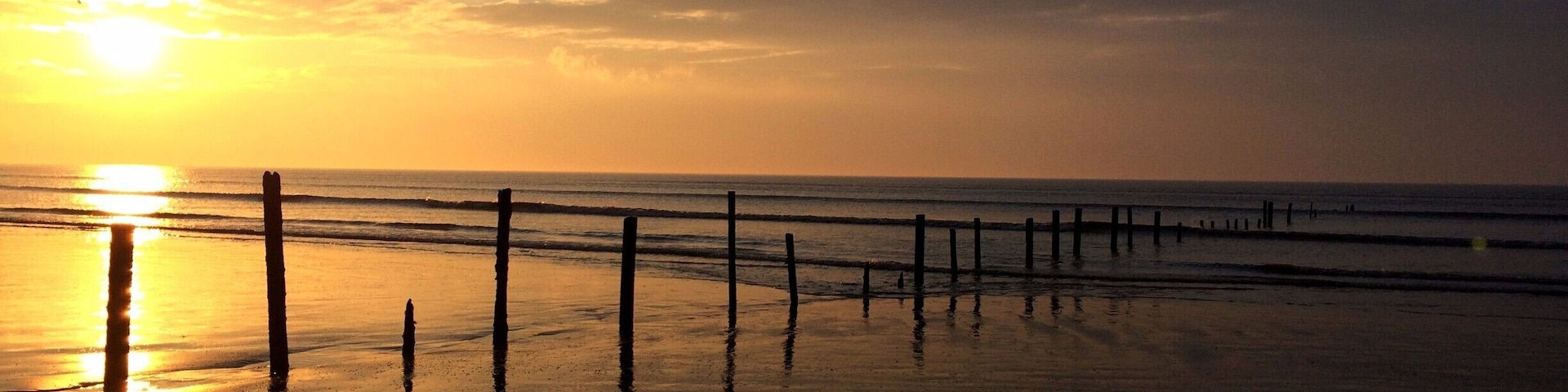 Berrow Beach at sunset. Large stretch of sand perfect for watching the sun go down #BeachBound