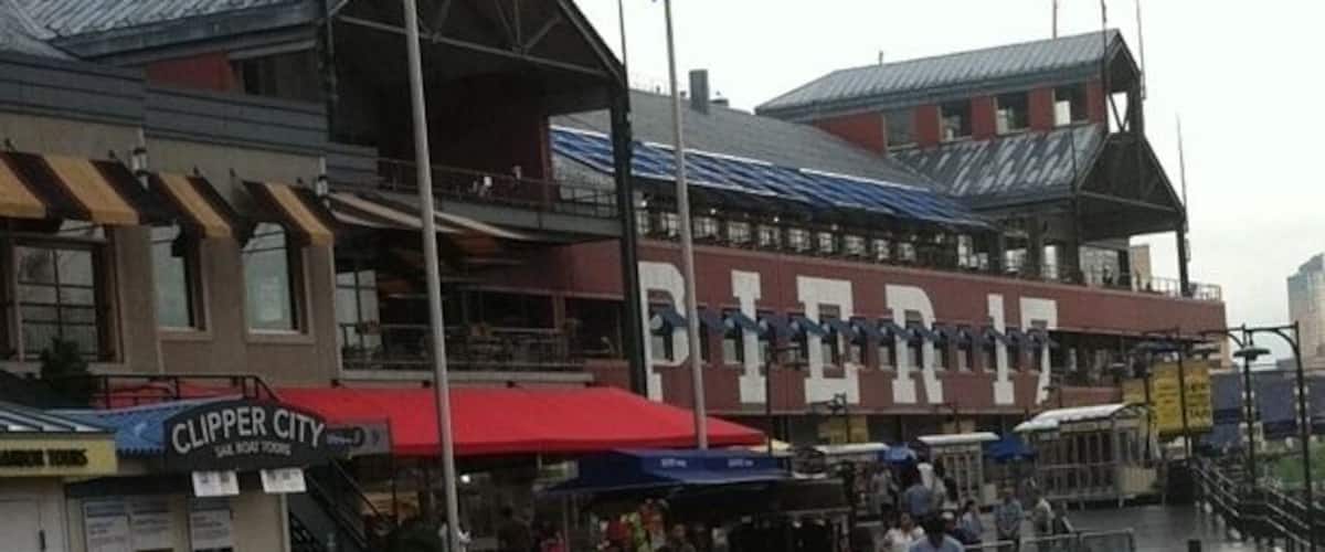 A pier with a 'Clipper City' sign, a red awning, and a 'Pier 17' sign.