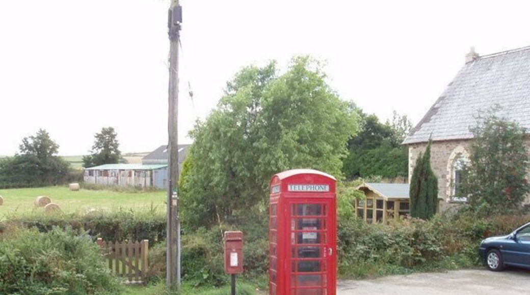 Red Phone box and letter box, Rosenannon. In the centre of the village, with the Methodist Church on the right. The letter box is a "lamp box", so called because it was designed to be attached to a lamp post, though this one has its own post. It has the E II R cipher.