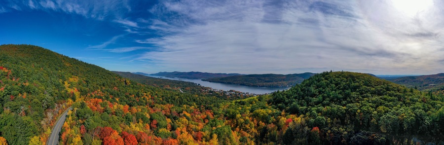 Panoramic Drone View of Lake George Adirondack Mountains During Peak Fall Foliage New York