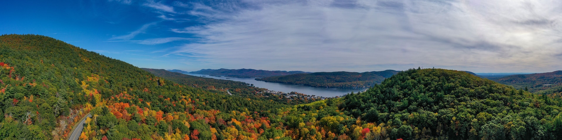 Panoramic Drone View of Lake George Adirondack Mountains During Peak Fall Foliage New York