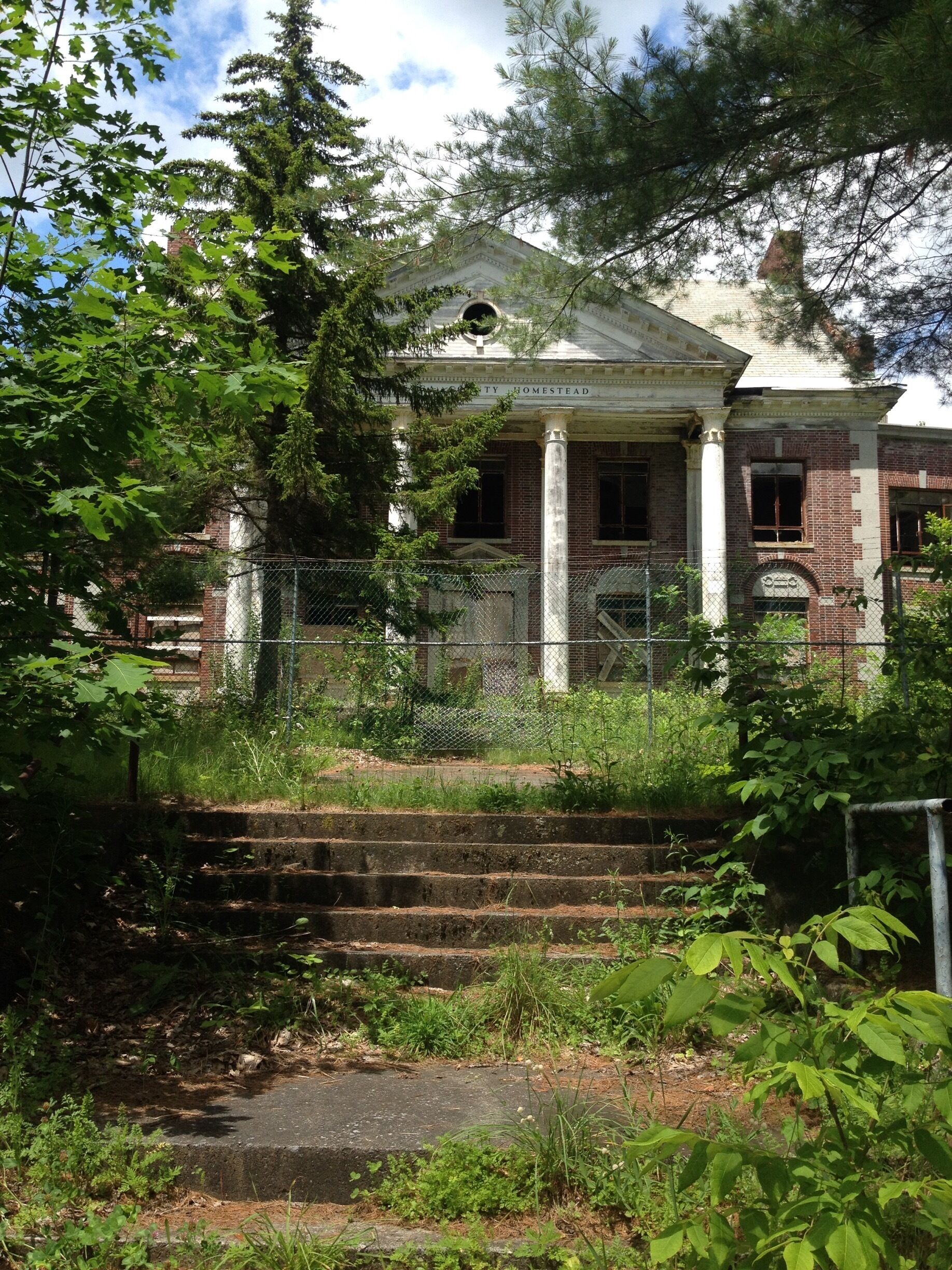 Front view of the Saratoga County Homestead in Providence NY. A tuberculosis Sanatorium from 1914-1960. Such a remarkably beautiful building. Too bad it sits to deteriorate and continues to be abused by vandals. A forgotten important era in history. 