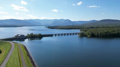 aerial view of the ashokan reservoir in upstate new york (near woodstock olivebridge) nyc drinking water and catskill mountains (catskills hills background) park road walkway bridge crossing lake pond
