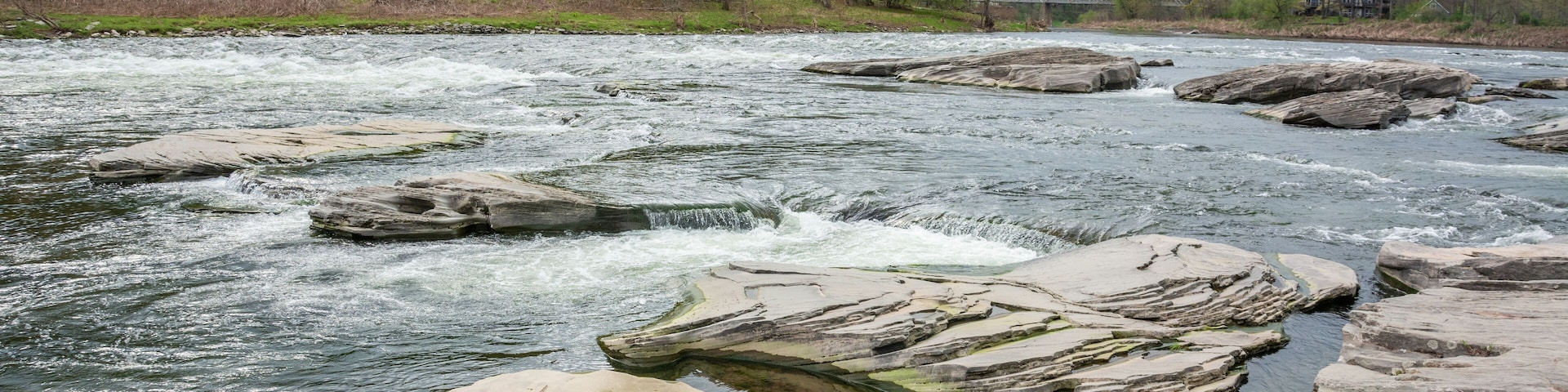 Cascades of Upper Delaware River at Skinners Falls Rocky Beach in Narrowsburg, NY.