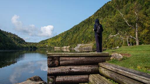 Hiker looking across the lower Cascade lake