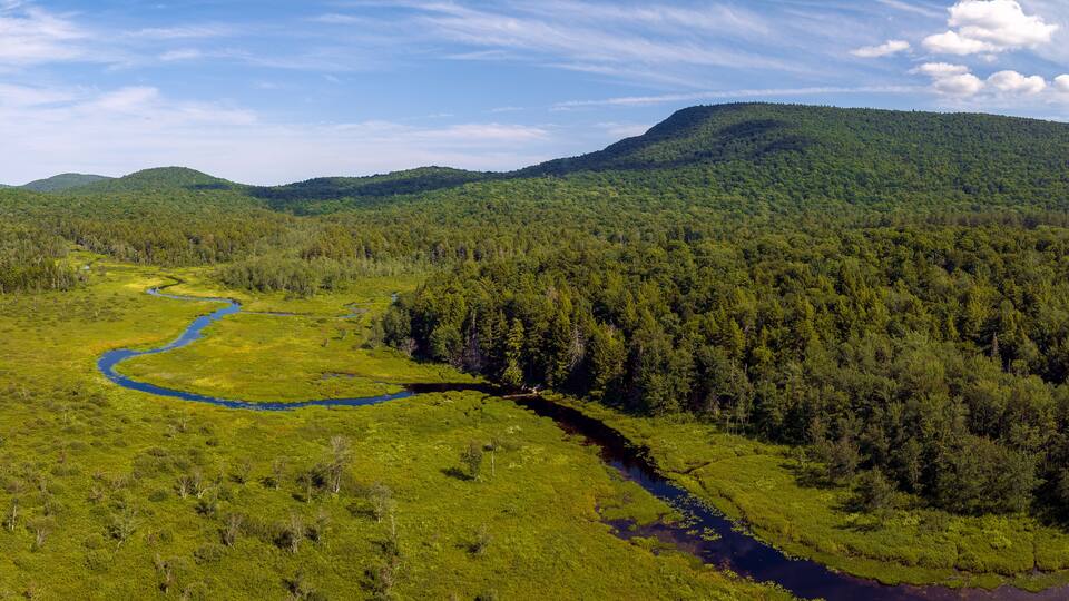 Aerial landscape panoramic of Speculator, New York located in the Adirondacks. July 10, 2022