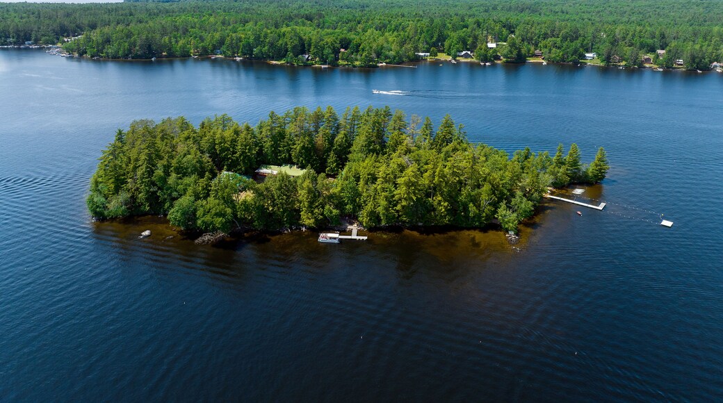 Aerial photograph of small island the town of Speculator, Lake Pleasant, Upstate, New York, Adirondacks, USA. July 1, 2022.