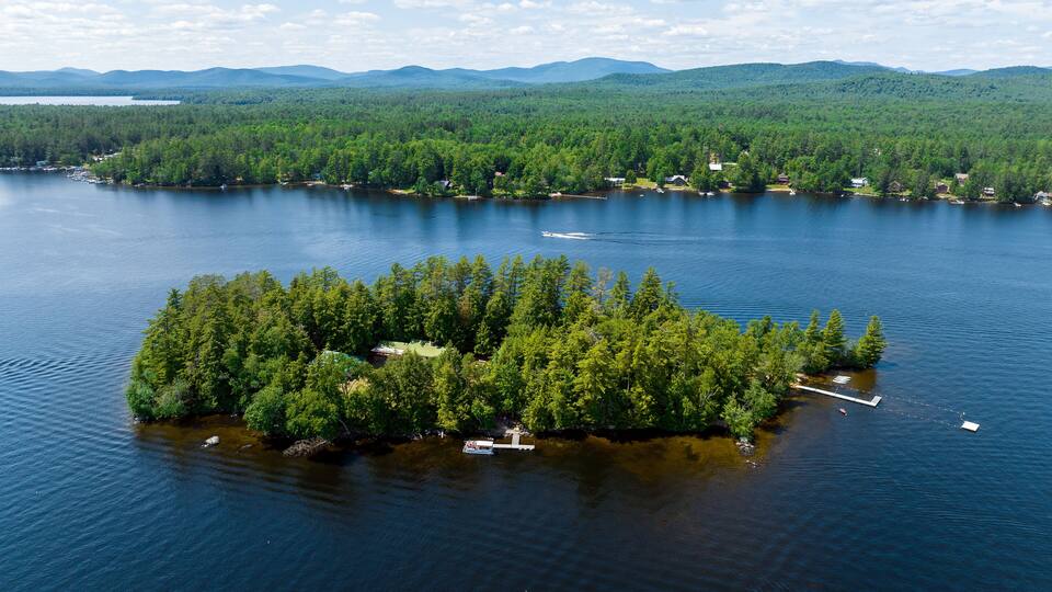 Aerial photograph of small island the town of Speculator, Lake Pleasant, Upstate, New York, Adirondacks, USA. July 1, 2022.