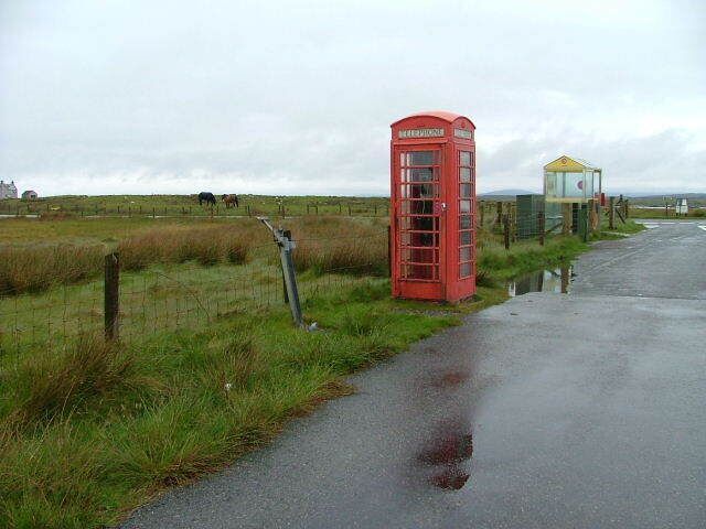 Telephone Box and Bus Shelter At the junction of the A865 and Kallin road on Grimsay.