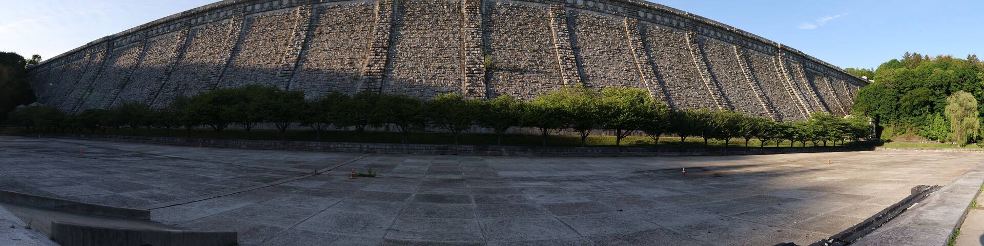 A large stone amphitheater with tiered seating and a flat central area.