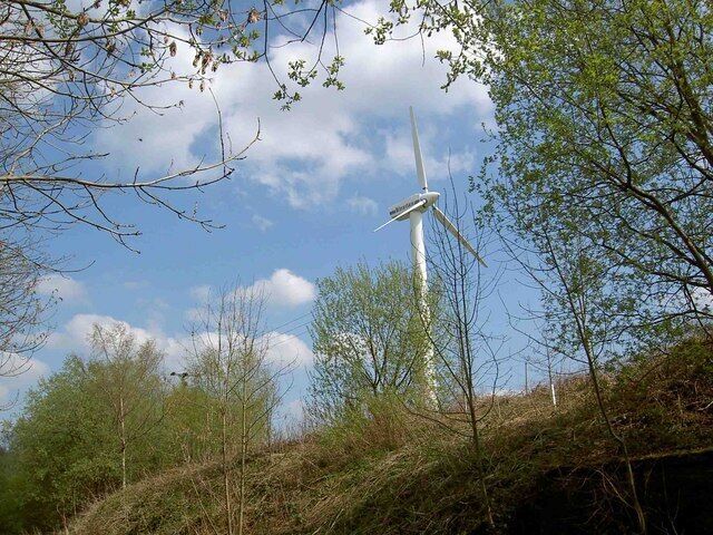 A single wind turbine looms over the Trans Pennine Trail