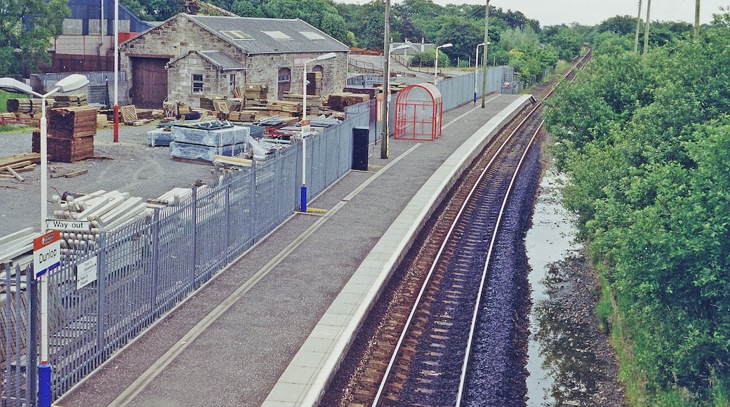 Dunlop station, 1996. View southward, towards Kilmarnock, Dumfries and Carlisle: ex-Caledonian & GSW (Glasgow, Barrhead & Kilmarnock) section of the Glasgow - Kilmarnock - Dumfries - Carlisle main line. The station was closed 11/66-6/67 and the line singled in 1975, but doubled again in 2009.