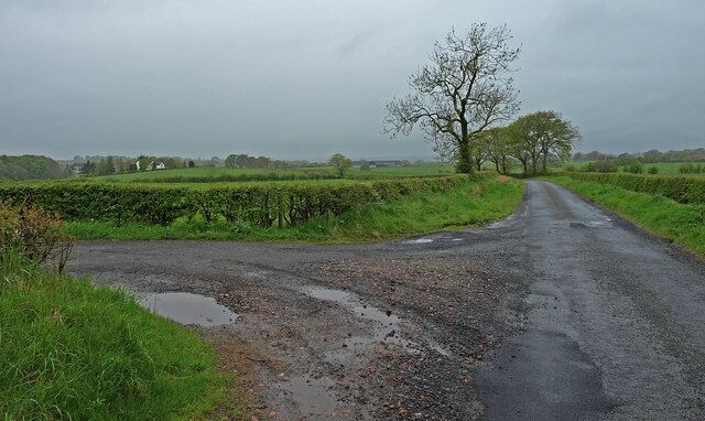 Country Road Road on the left leads to Merrymouth farm. View towards Dunlop.