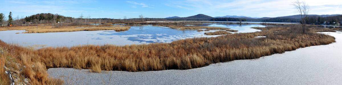 Tupper Lake panorama in winter with snow in town of Tupper Lake, Adrondack Mountains, New York, USA.