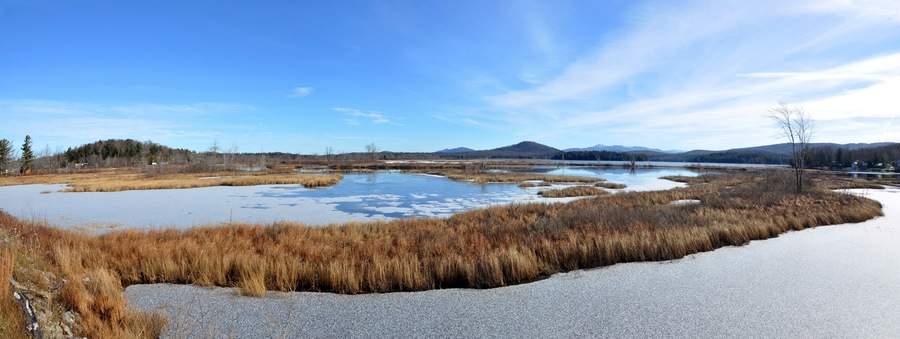 Tupper Lake panorama in winter with snow in town of Tupper Lake, Adrondack Mountains, New York, USA.