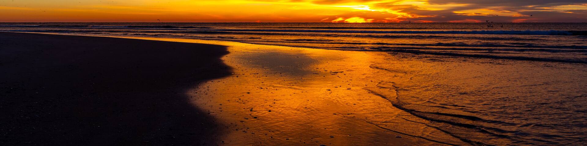 Orange Cloudy Sunrise on Beach 1