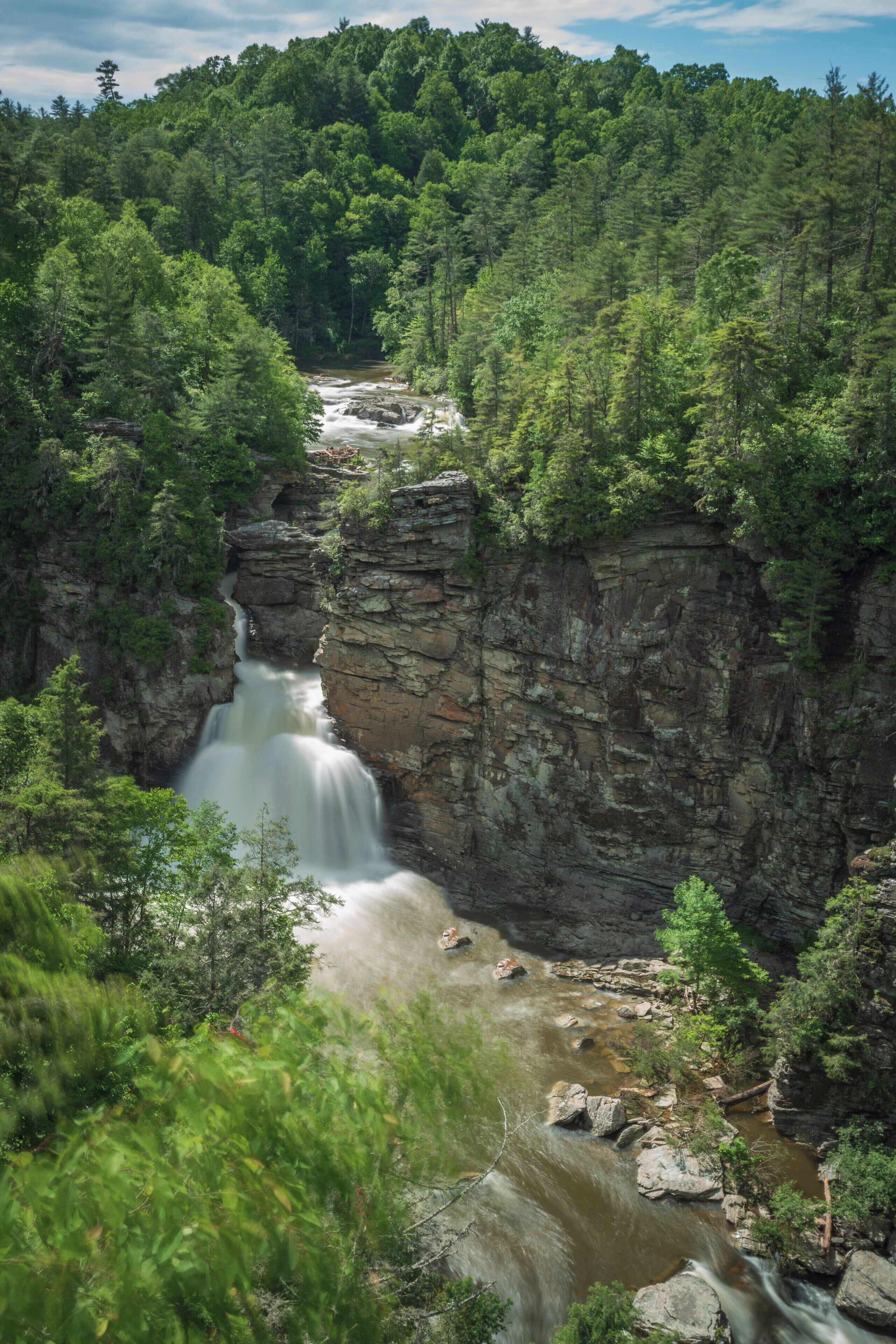 It had been raining steadily for days near Linville Falls.  Parts of the Blue Ridge Parkway were inaccessible, but the rains made for a spectacular view of the falls after a relatively short hike.  This photo taken at 36mm, F/16.0, 6 sec. @ ISO 100.
