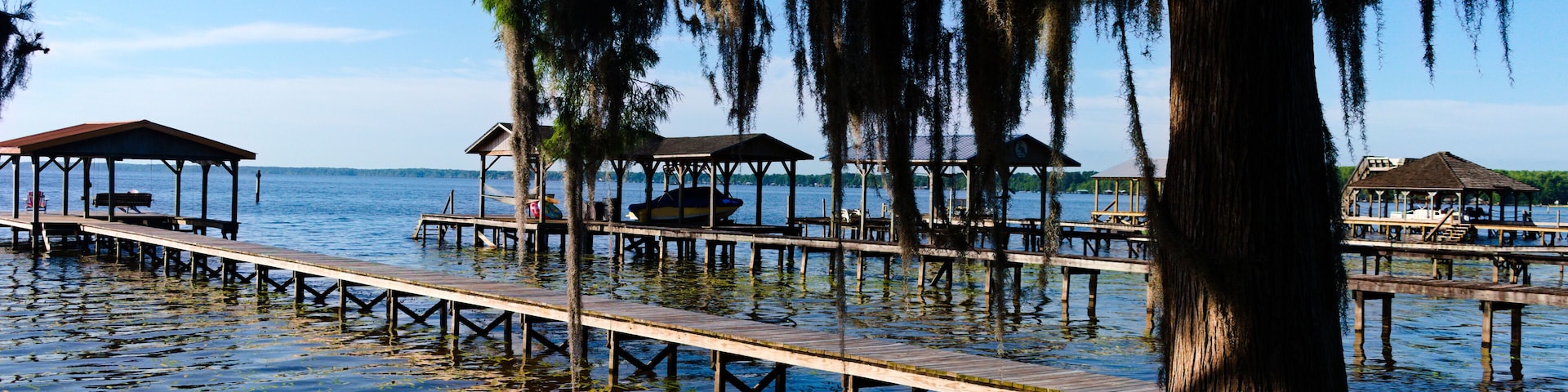 Early morning sun shines across Lake Waccamaw