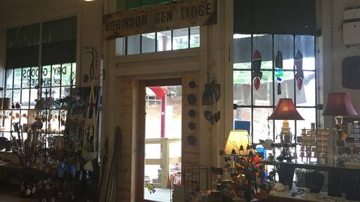 The interior of the One of A Kind (OOAK) art gallery in Micaville, NC. With a slogan of “fine, folk, and funky”, this place embodies Appalachian art and culture-- down to the very building it stands in. When Micaville was a mining town, this building was the general store. Through the years, the “Robinson General Merchandise” sign and painted windows have remained mostly untouched, which provides a unique and rare frame of this location through time. The new framed alongside the old emphasizes that Appalachia holds strong to tradition and legacy. #appalachianechoes