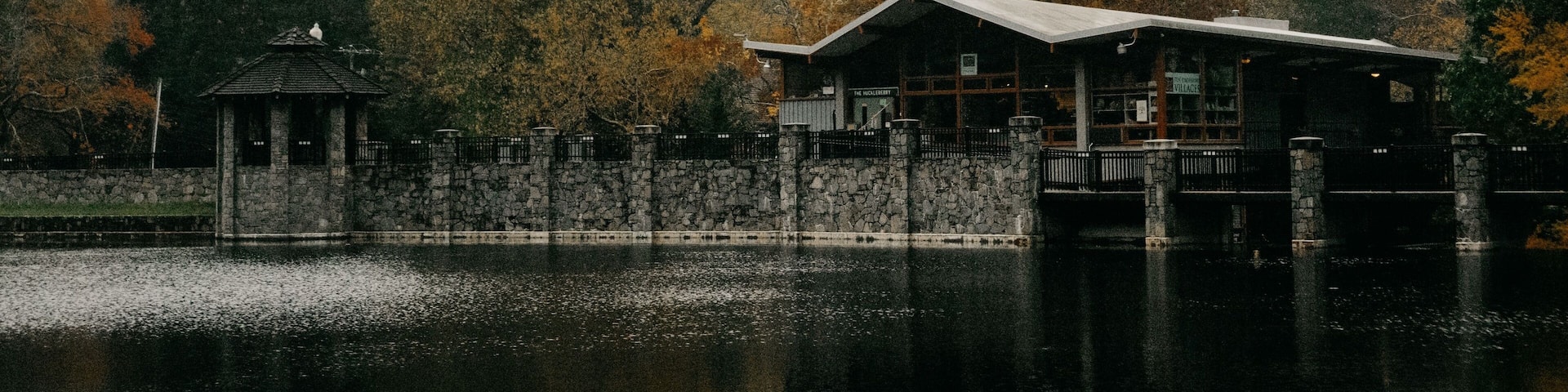 View of the lake and buildings against the background of a hill. Montreat, North Carolina.