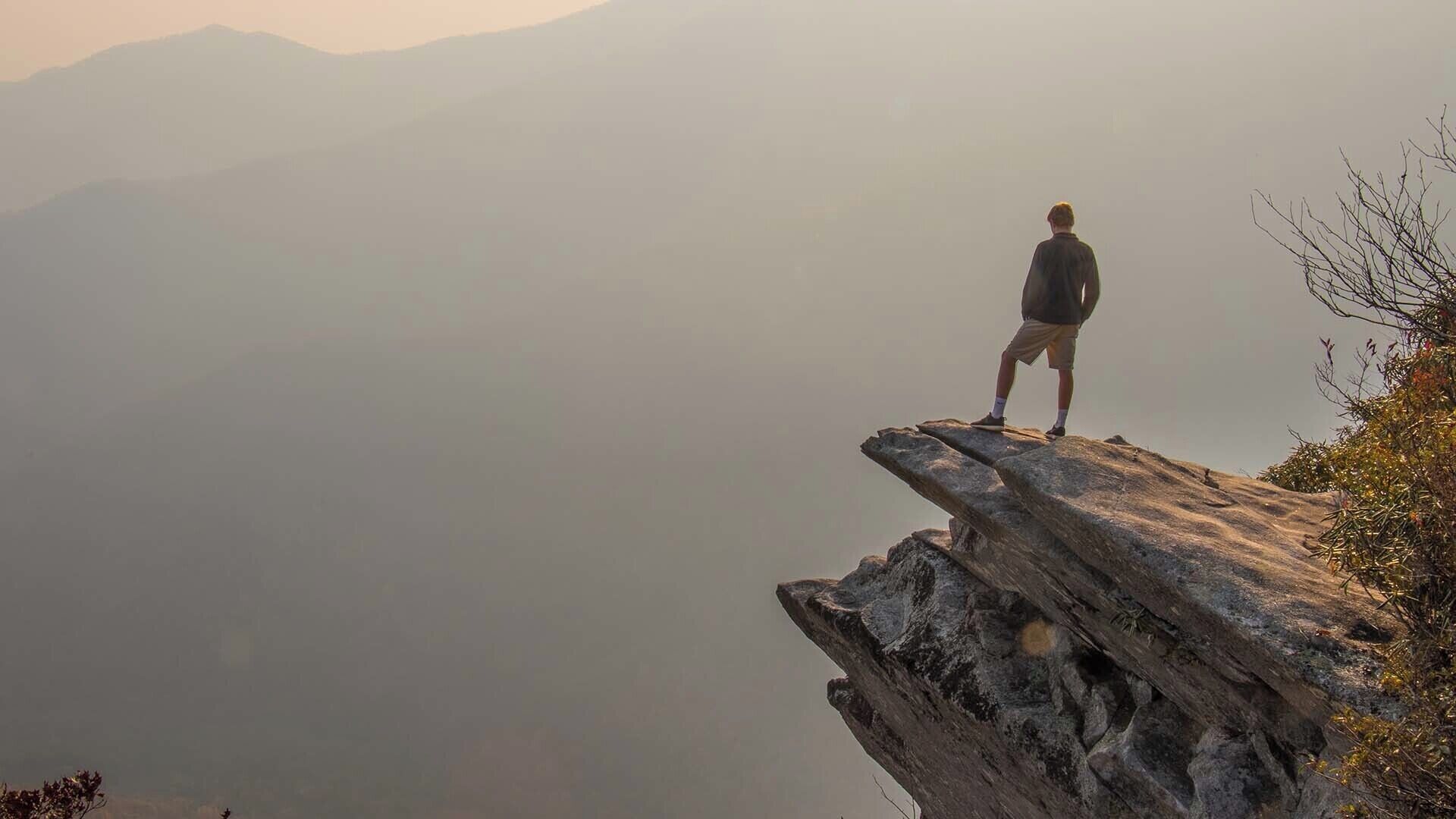 The place with a funny name:  Pickens Nose.  Despite the weird name, this is a great spot to visit as it provides breathtaking views of the surrounding mountains.  This particular shot was during the Summer when there were numerous wildfires in the area.

View a full video guide here:  https://www.hdcarolina.com/episode/pickens-nose