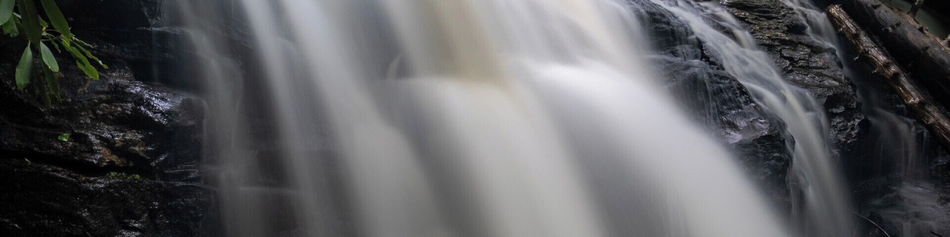 The beautiful and easy to reach Mooney Falls of the Nantahala National Forest in North Carolina. Near Franklin, NC this long waterfall is accessed via a very short (about 1/4 mile) trail. For a video guide of the hike to Mooney Falls, please visit: https://www.hdcarolina.com/episode/mooney-falls