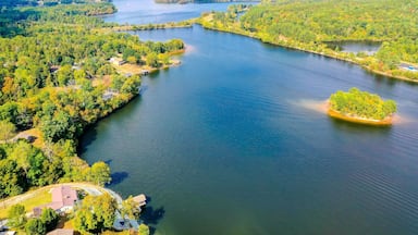 Aerial shot of Belews Lake in North Carolina, USA with a small island, houses, powerplant