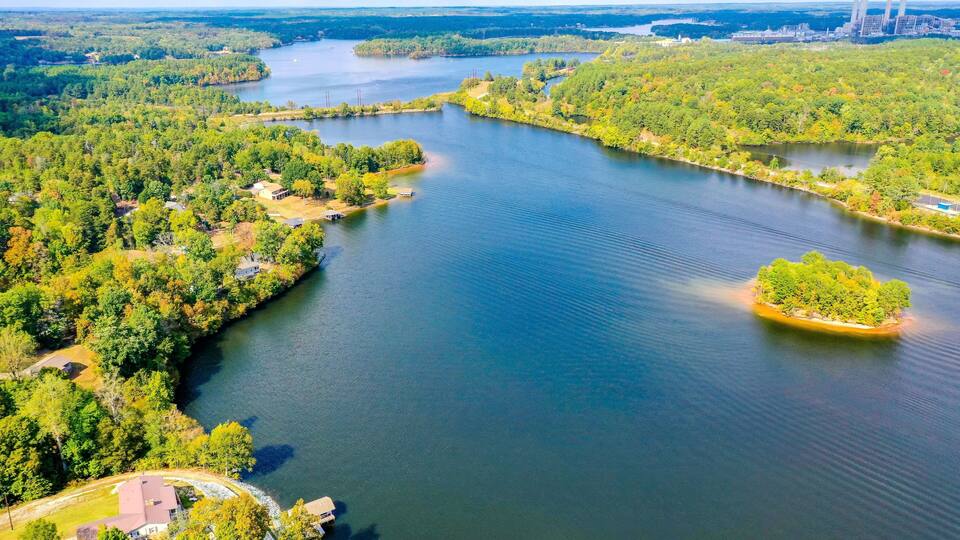 A large river with surrounding forested areas and a small island.