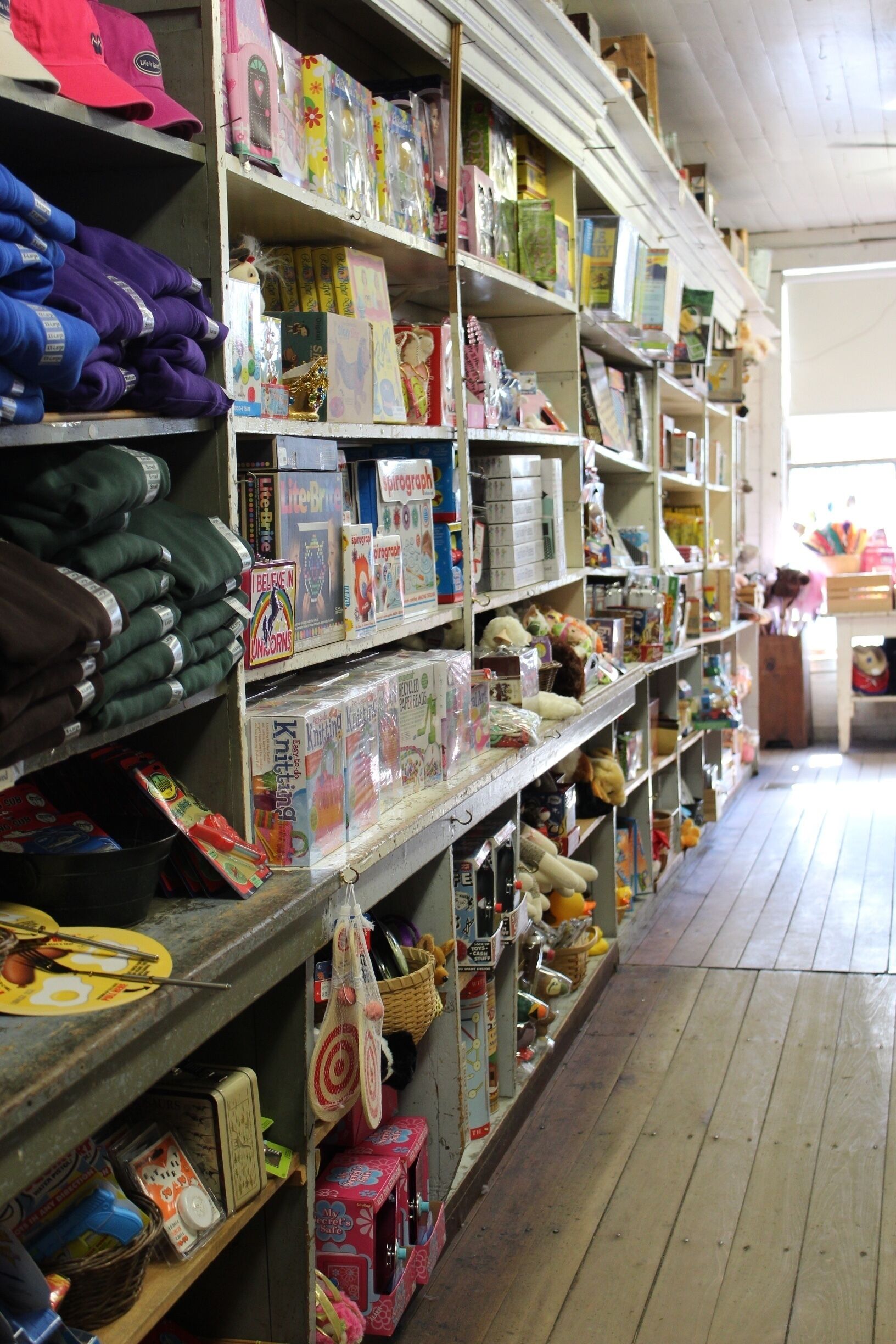 The theme I keep returning to is that of modern lifestyles throughout seemingly "old," "rustic," and "quaint" Appalachia. The stereotypical idea is that Appalachia is in itself somehow frozen in the past has been a common thought for a long time. By including pictures that present this on the surface seem to embrace that stereotype. If one takes the time to learn the story behind the picture, the meaning changes. For example, this picture in the Mast General Store has all of the "rustic" ideas incorporated into it. However, there are other things that suggest the existence of the modern lifestyle. At first, it looks just like a bunch of old toys. But then, the new clothes and packaging in the picture suggest something else. The toys themselves even look modern.  #appalachianechoes 