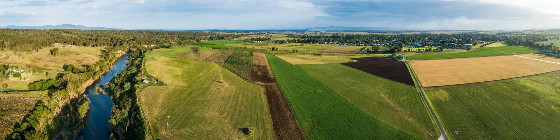 Hunter River running past fertile Australian farmland river flats in summer