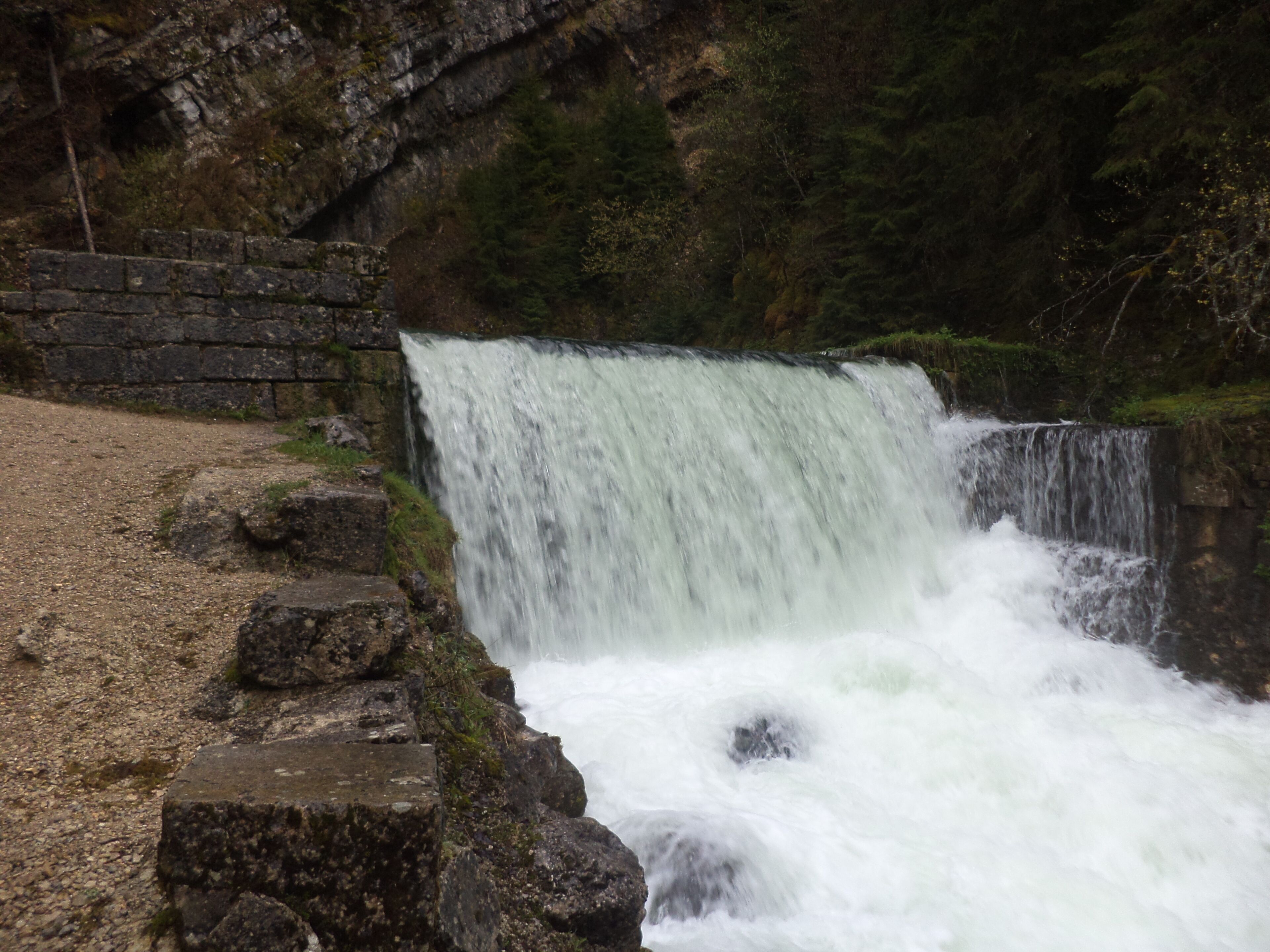 Small waterfall on the source of the river Doubs in the French Jura