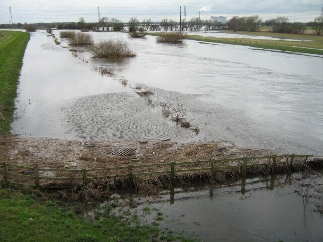 Flow of Aire Eggborough power station in the distance across the flood plain