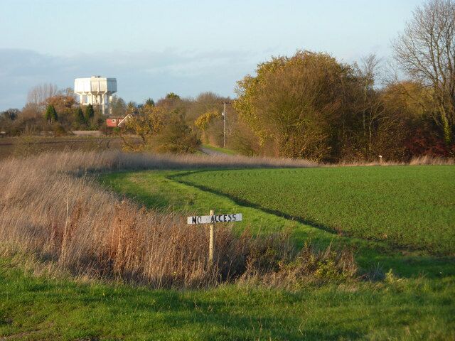 By Blacksmith's Lane towards Middlewood Green The lane follows the left edge of the line of tall brown grasses. The water tower can be seen in the distance. The are many "no access" signs in the area, but fortunately there are a few footpaths as well.