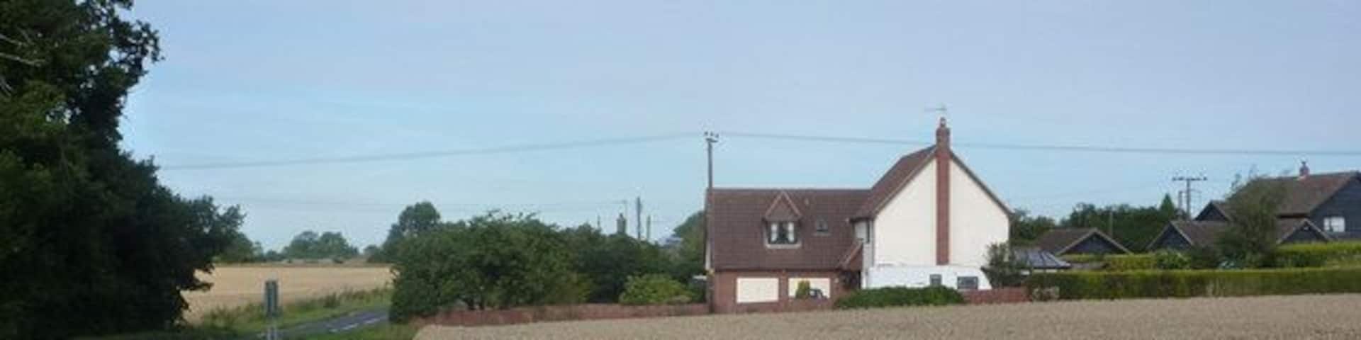 By the A1120 at Forward Green, Earl Stonham The house to the right are on Wicks Lane. Taken standing almost opposite the entrance to the village hall.