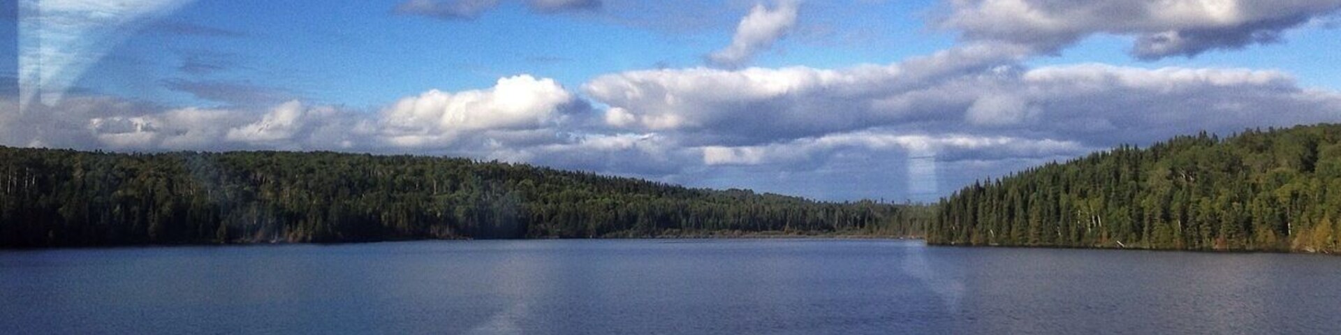 One of a billion lakes it seems out here. Sorry for the glare but it's through a window.