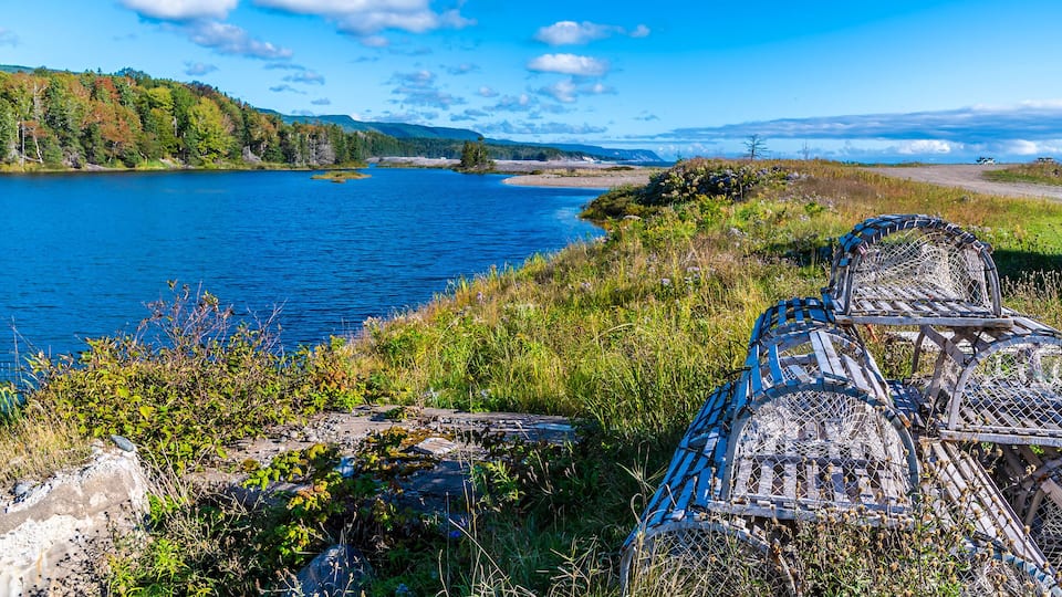 A view past lobster pots along the MacDonalds pond at the Little River on the Cabot Trail, Nova Scotia, Canada in the fall