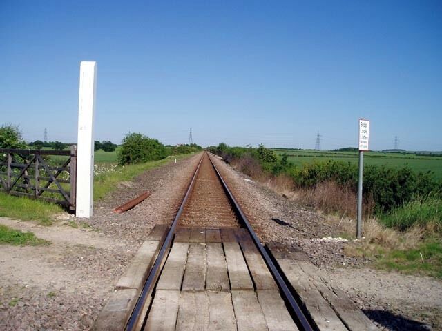 Level crossing near Great Wilbraham. An uncontrolled, gated level crossing (though the gates were left open) carrying a farm track and public footpath over the Cambridge-Newmarket railway.