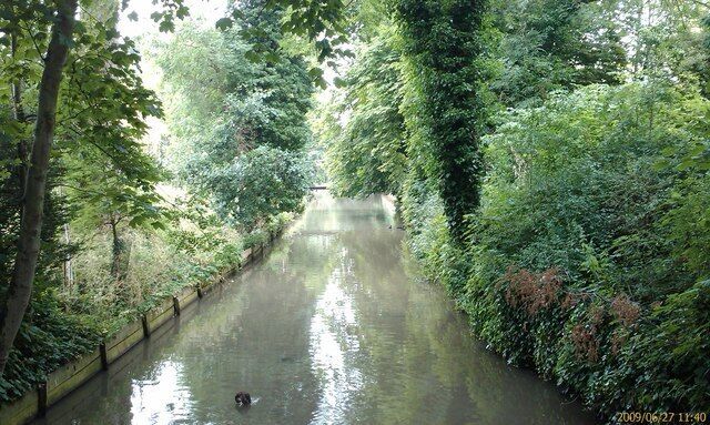 River Granta looking downstream towards the High Street road bridge Impounded, straightened river reach, River Granta, Linton, Cambridgeshire.