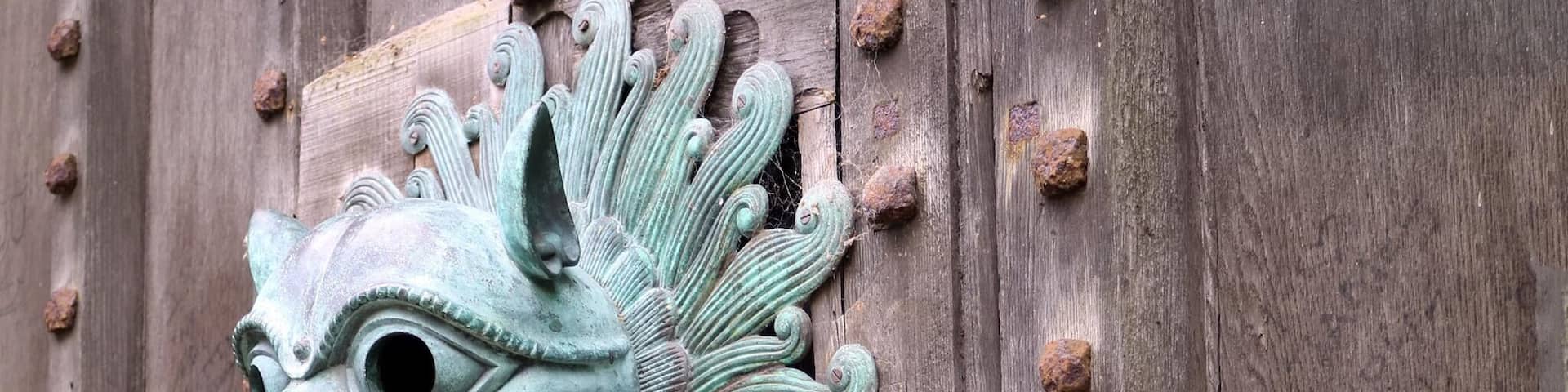 Knocker on door with sanctuary ring