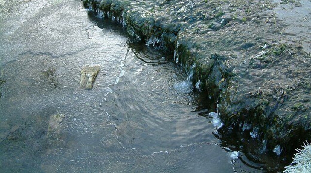Winter stream. A partially frozen waterfall in Bradford Dale, Derbyshire. The section of waterfall shown is some 1.5 metres (5 feet) across.