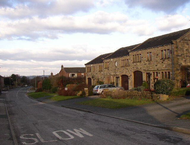 New houses in Stocksmoor, Thurstonland, Yorkshire. Stocksmoor is expanding into a village, perhaps because it has a station on the Huddersfield to Sheffield railway. There are more similar houses on the other side of the road.